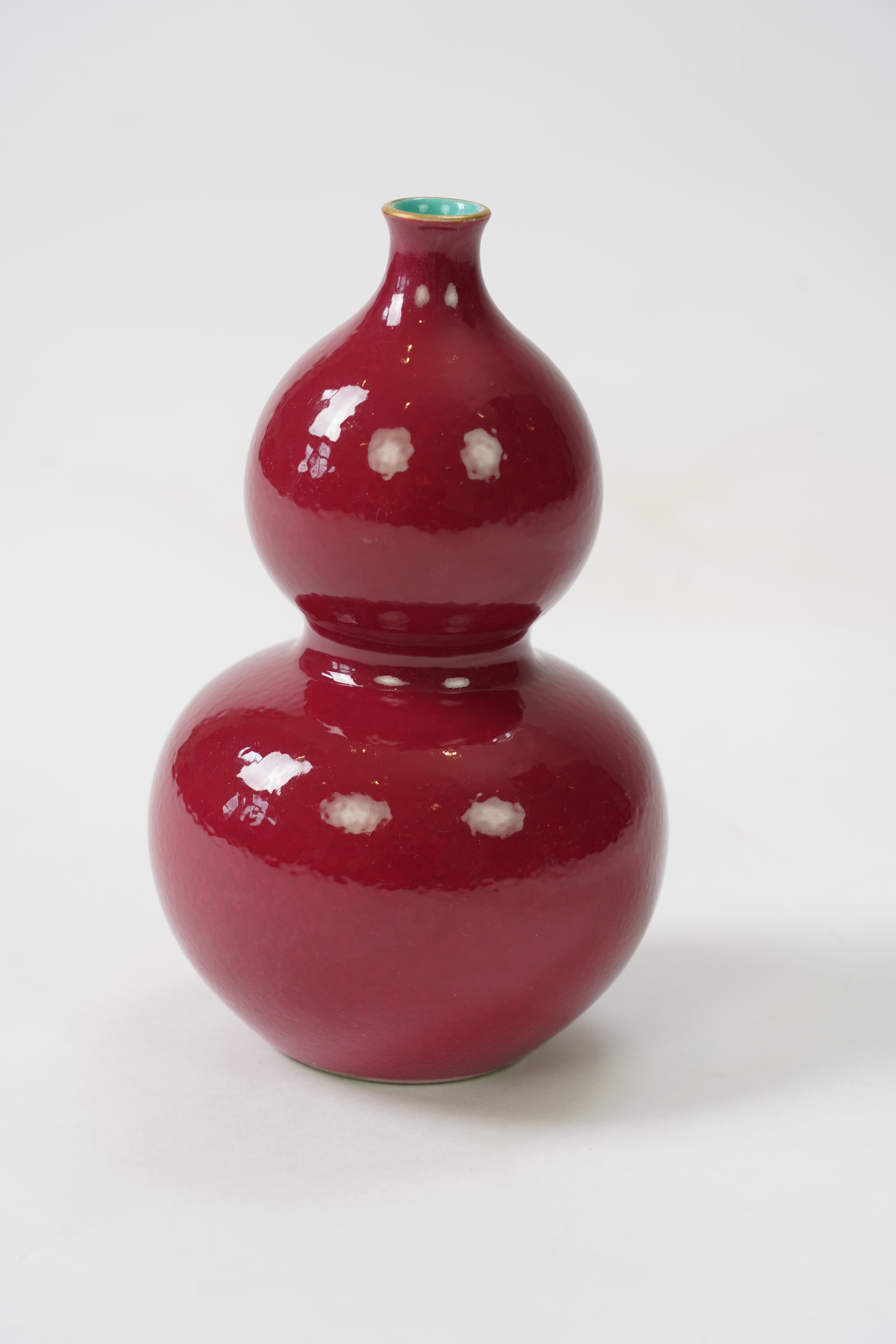 A Chinese ruby ground double gourd vase, Qianlong seal mark but later